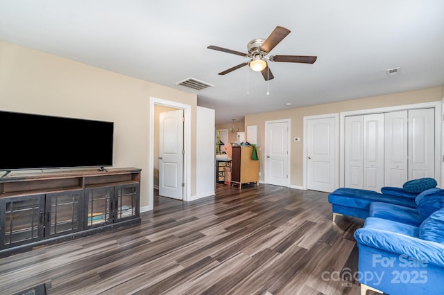 319 Leonard Ave, Albemarle, NC 28001 - living area with ceiling fan, wood finished floors, and baseboards