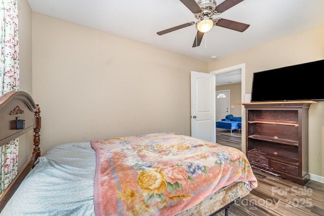 319 Leonard Ave, Albemarle, NC 28001 - bedroom featuring wood finished floors, a ceiling fan, and baseboards