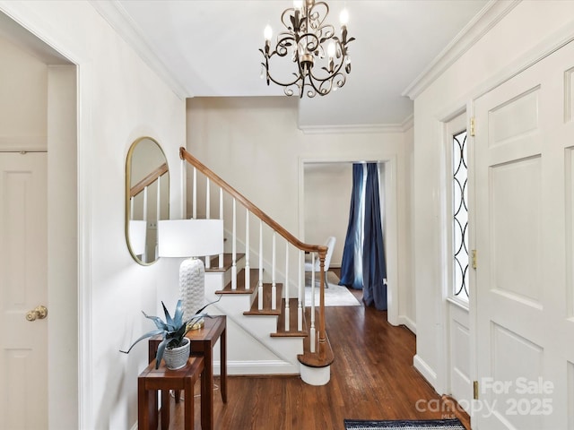 1049 Regency Dr, Charlotte, NC 28211 - foyer entrance with wood finished floors, a chandelier, stairway, baseboards, and crown molding