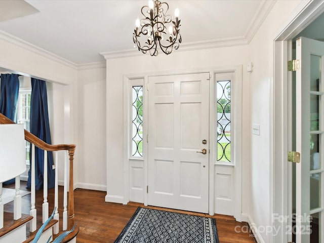 1049 Regency Dr, Charlotte, NC 28211 - entrance foyer with dark wood-type flooring, ornamental molding, baseboards, a chandelier, and healthy amount of natural light