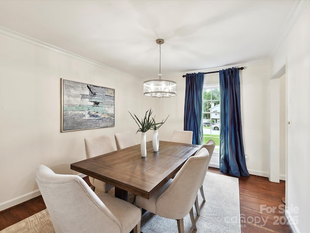 1049 Regency Dr, Charlotte, NC 28211 - dining area with a chandelier, crown molding, wood finished floors, and baseboards