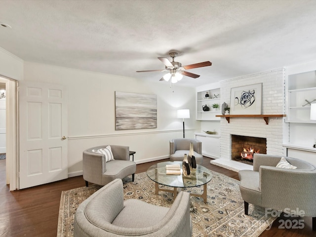 1049 Regency Dr, Charlotte, NC 28211 - living room with dark wood-type flooring, a ceiling fan, and a fireplace