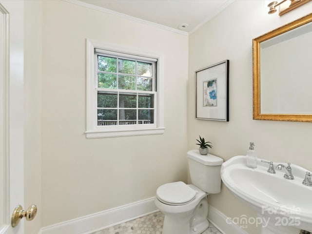 1049 Regency Dr, Charlotte, NC 28211 - bathroom featuring baseboards, a sink, crown molding, and toilet