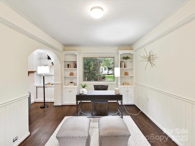 1049 Regency Dr, Charlotte, NC 28211 - office with wainscoting, dark wood-type flooring, arched walkways, and built in shelves