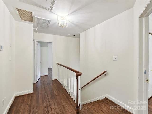 1049 Regency Dr, Charlotte, NC 28211 - hall with an upstairs landing, attic access, baseboards, and wood finished floors