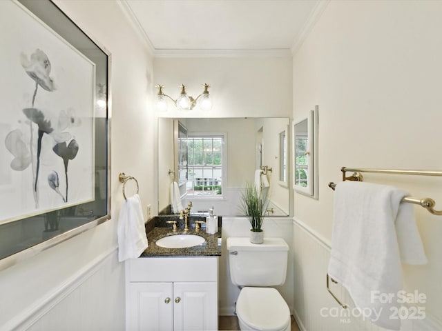 1049 Regency Dr, Charlotte, NC 28211 - bathroom with ornamental molding, toilet, a wainscoted wall, and vanity