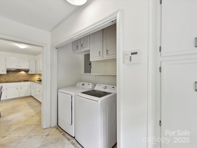 1049 Regency Dr, Charlotte, NC 28211 - washroom featuring independent washer and dryer, cabinet space, light tile patterned flooring, and electric panel