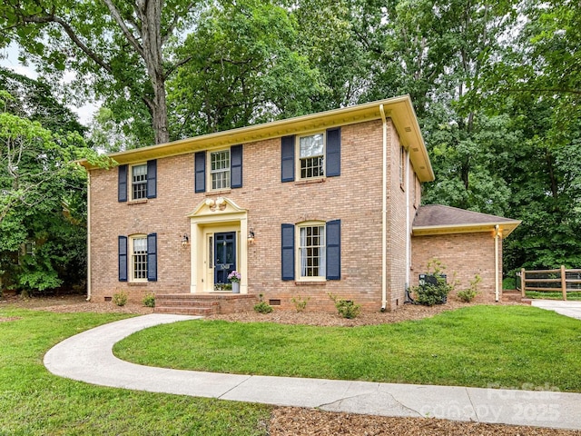 1049 Regency Dr, Charlotte, NC 28211 - colonial inspired home featuring brick siding, crawl space, and view of scattered trees