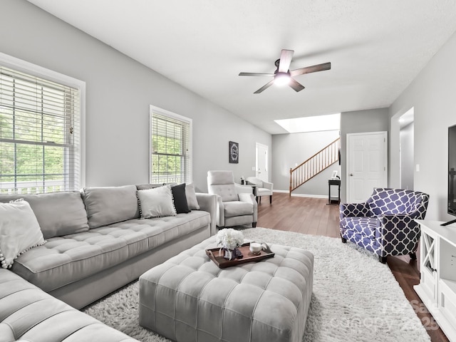 642 Bull Creek Rd, Mars Hill, NC 28754 - living area featuring a ceiling fan, wood finished floors, stairs, and baseboards
