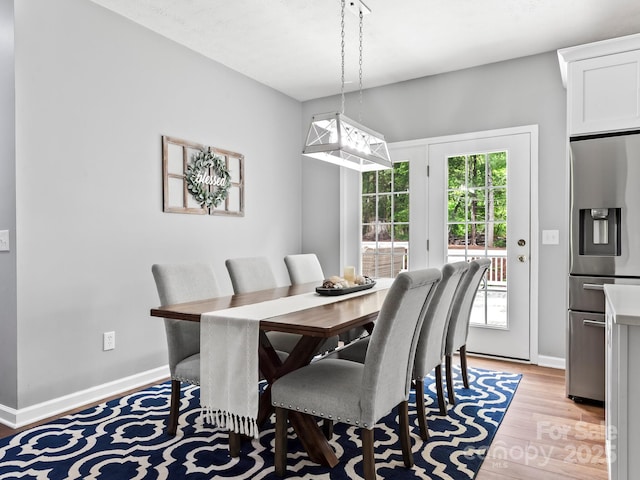 642 Bull Creek Rd, Mars Hill, NC 28754 - dining room featuring light wood-type flooring and baseboards