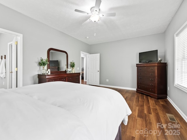 642 Bull Creek Rd, Mars Hill, NC 28754 - bedroom with wood finished floors, baseboards, a ceiling fan, and a textured ceiling