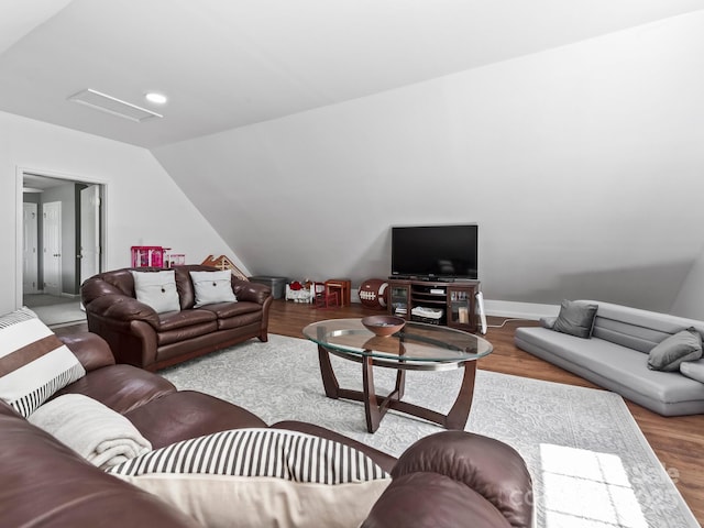642 Bull Creek Rd, Mars Hill, NC 28754 - living area featuring wood finished floors, lofted ceiling, attic access, and baseboards