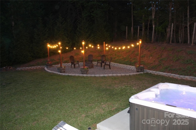 642 Bull Creek Rd, Mars Hill, NC 28754 - view of grassy yard featuring a hot tub, a patio, and an outdoor fire pit