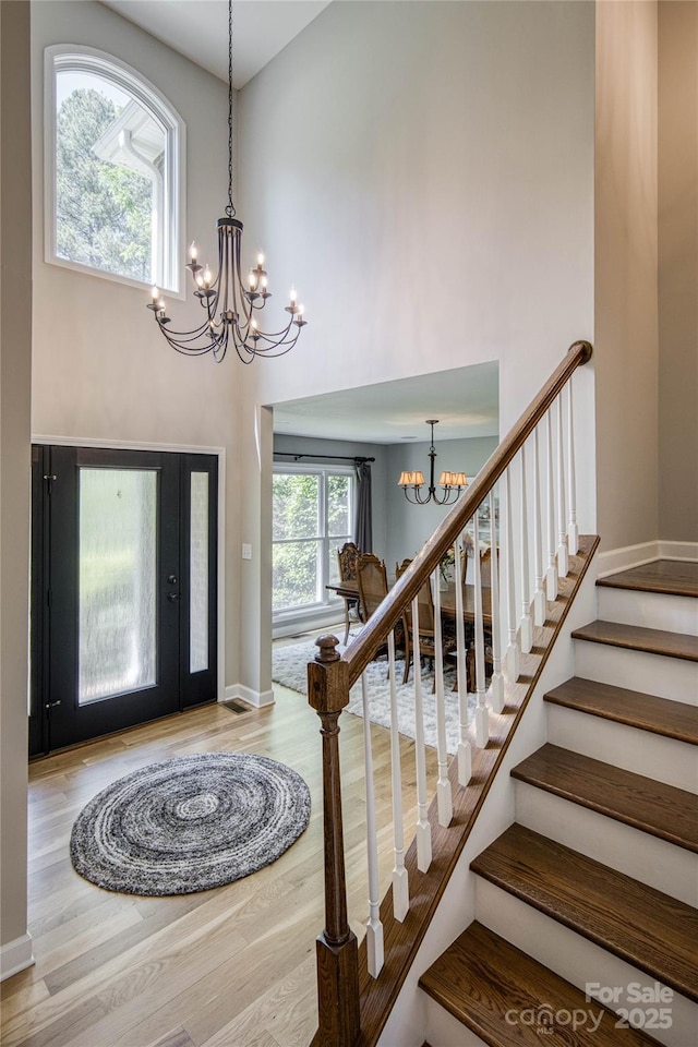 206 Ridge Top Dr, Connelly Springs, NC 28612 - foyer entrance featuring a chandelier, wood finished floors, a high ceiling, baseboards, and stairway