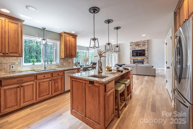 206 Ridge Top Dr, Connelly Springs, NC 28612 - kitchen featuring stainless steel appliances, a sink, brown cabinetry, and recessed lighting