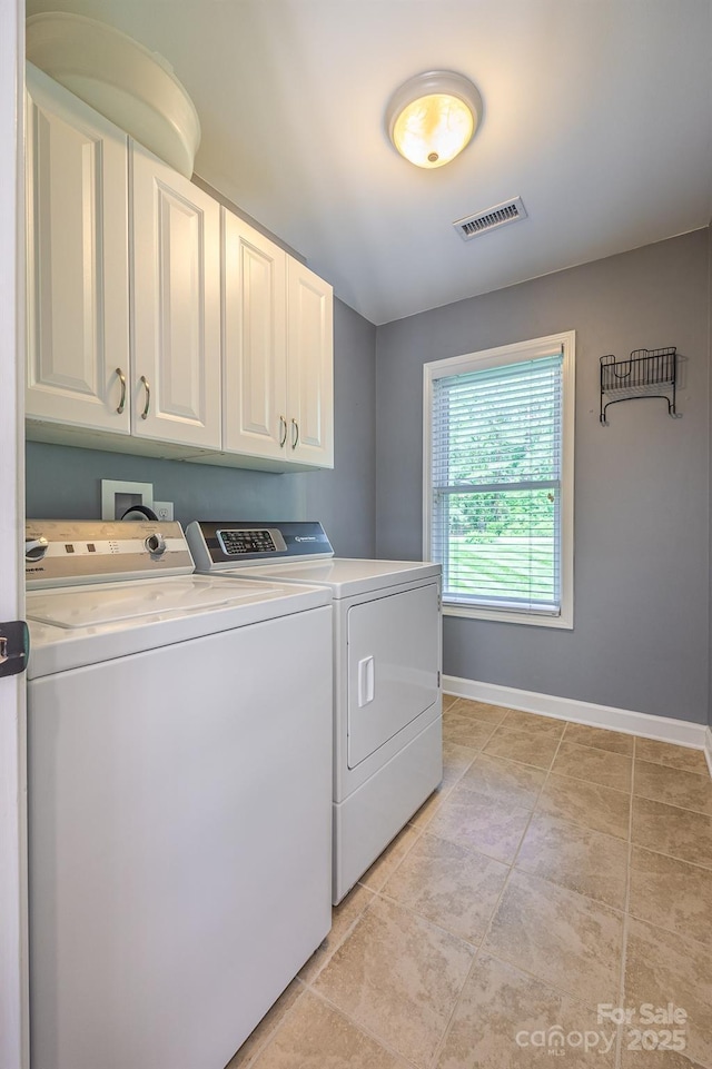 206 Ridge Top Dr, Connelly Springs, NC 28612 - laundry area with cabinet space, separate washer and dryer, baseboards, and light tile patterned flooring