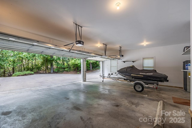 206 Ridge Top Dr, Connelly Springs, NC 28612 - garage featuring a garage door opener and baseboards