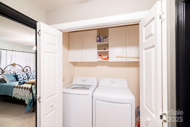 laundry room with cabinet space, washer and dryer, and carpet floors