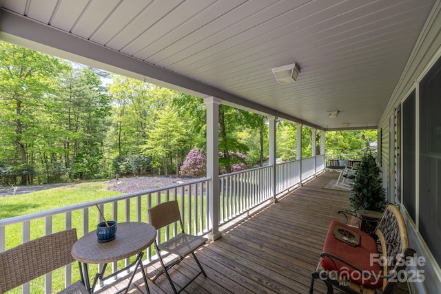 wooden deck with a yard