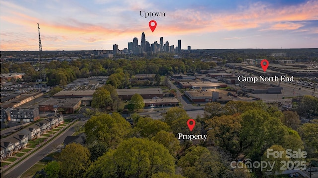 2201 Grimes St, Charlotte, NC 28206 - aerial view at dusk of a skyline view and view of wooded area