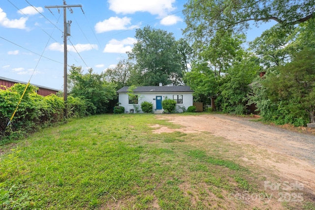 2201 Grimes St, Charlotte, NC 28206 - view of grassy yard with dirt driveway