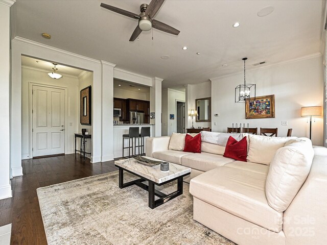 5425 Closeburn Rd, Charlotte, NC 28210 - living area featuring a ceiling fan, crown molding, a chandelier, wood finished floors, and recessed lighting