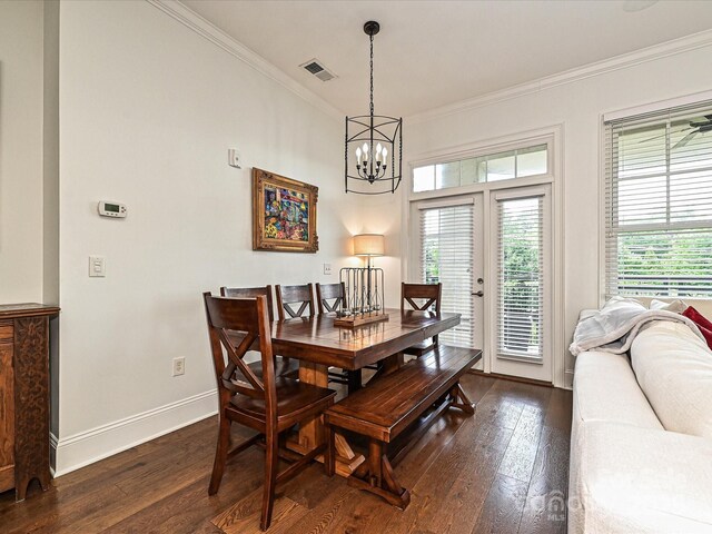 5425 Closeburn Rd, Charlotte, NC 28210 - dining area with crown molding, dark wood-style floors, a chandelier, and baseboards