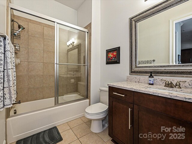 5425 Closeburn Rd, Charlotte, NC 28210 - full bath with vanity, tile patterned flooring, toilet, and shower / bath combination with glass door