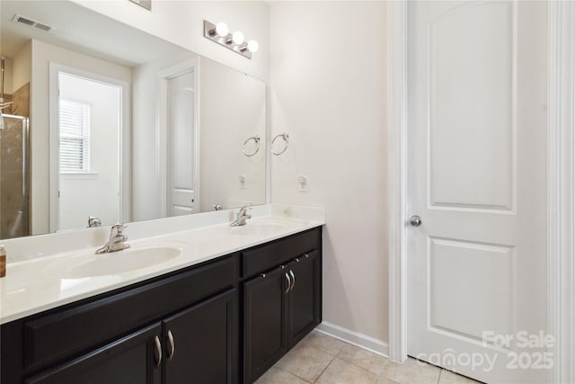 4935 Norman Park Pl, Clover, SC 29710 - bathroom featuring double vanity, tile patterned floors, a shower, and baseboards