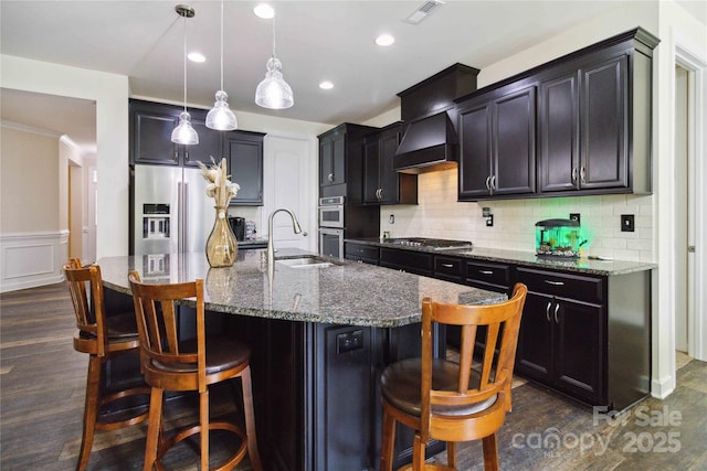 4935 Norman Park Pl, Clover, SC 29710 - kitchen featuring stainless steel appliances, a sink, dark stone countertops, dark wood finished floors, and recessed lighting