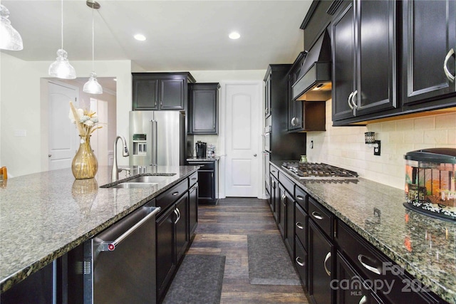 4935 Norman Park Pl, Clover, SC 29710 - kitchen with appliances with stainless steel finishes, a sink, dark stone countertops, dark wood-type flooring, and decorative backsplash