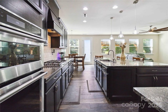 4935 Norman Park Pl, Clover, SC 29710 - kitchen featuring a sink, appliances with stainless steel finishes, decorative light fixtures, dark wood-style flooring, and ceiling fan