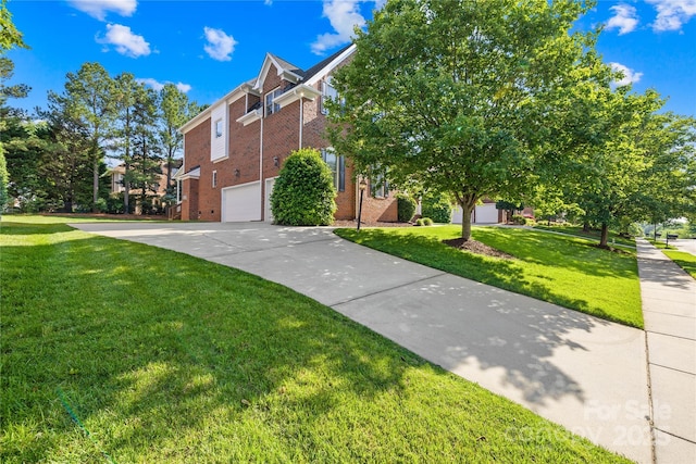 10024 Hazelview Dr, Charlotte, NC 28277 - view of front of home featuring an attached garage, driveway, brick siding, and a front lawn