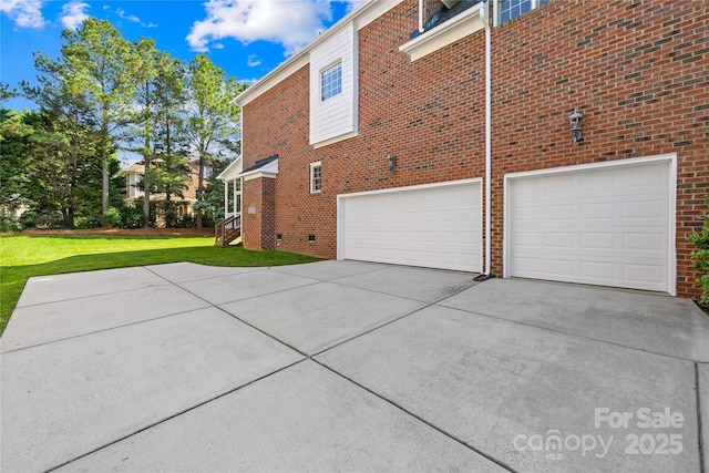 10024 Hazelview Dr, Charlotte, NC 28277 - view of side of home with driveway, a garage, a lawn, and brick siding