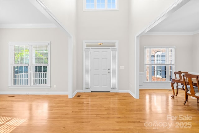 10024 Hazelview Dr, Charlotte, NC 28277 - entryway featuring light wood finished floors, ornamental molding, and baseboards