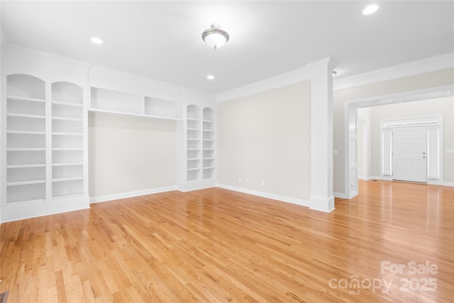 10024 Hazelview Dr, Charlotte, NC 28277 - empty room featuring crown molding, light wood-style flooring, baseboards, built in features, and recessed lighting