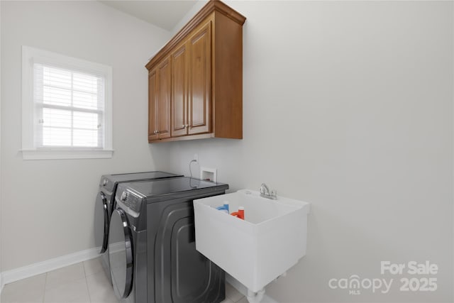 10024 Hazelview Dr, Charlotte, NC 28277 - laundry area featuring washer and clothes dryer, cabinet space, baseboards, and light tile patterned floors