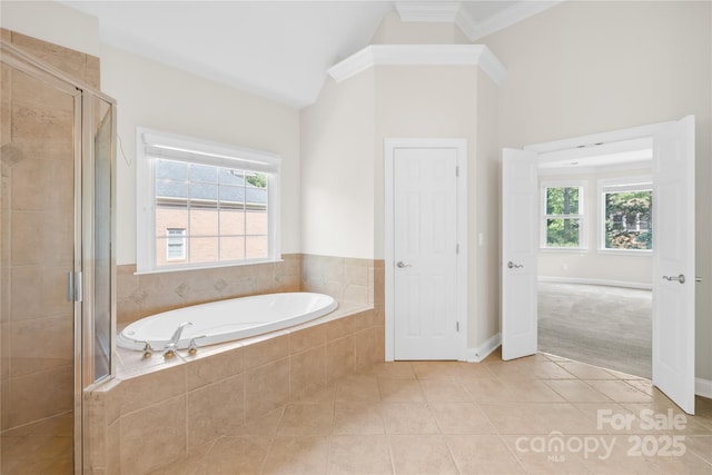 10024 Hazelview Dr, Charlotte, NC 28277 - bathroom featuring a garden tub, tile patterned floors, a shower stall, healthy amount of natural light, and ornamental molding