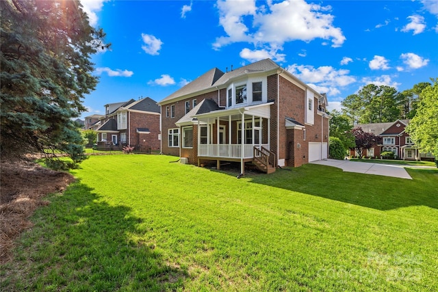 10024 Hazelview Dr, Charlotte, NC 28277 - back of property featuring brick siding, concrete driveway, a garage, and a lawn