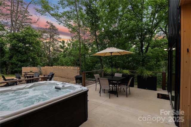 7 Big Rocky Top Dr, Weaverville, NC 28787 - patio terrace at dusk with a hot tub, outdoor dining space, and a patio area
