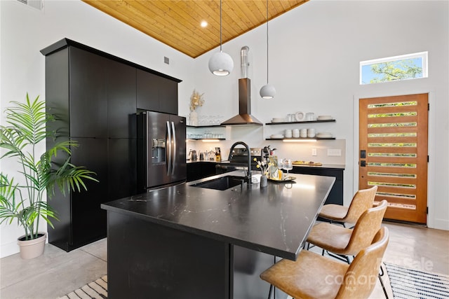 7 Big Rocky Top Dr, Weaverville, NC 28787 - kitchen featuring stainless steel refrigerator with ice dispenser, wood ceiling, wall chimney exhaust hood, dark cabinetry, and open shelves