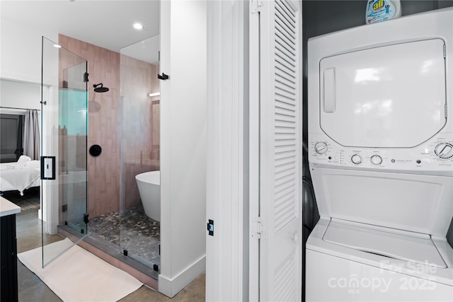 7 Big Rocky Top Dr, Weaverville, NC 28787 - bathroom featuring estacked washer and dryer, a closet, a stall shower, ensuite bath, and recessed lighting