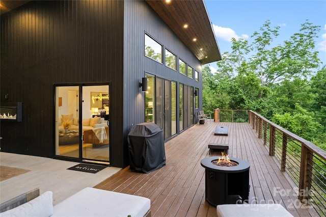 7 Big Rocky Top Dr, Weaverville, NC 28787 - wooden deck with a fire pit and grilling area