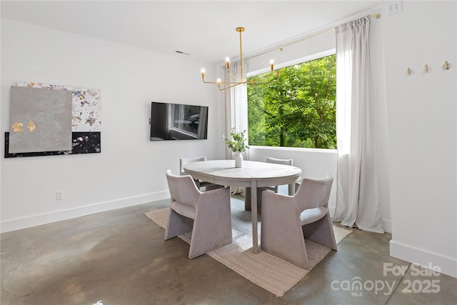 7 Big Rocky Top Dr, Weaverville, NC 28787 - dining area with concrete flooring and a chandelier
