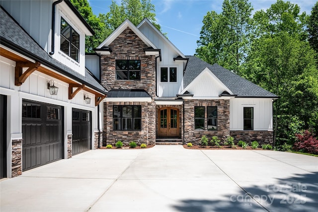 7703 Juniper Ln, Denver, NC 28037 - view of front of home with stone siding, board and batten siding, roof with shingles, and concrete driveway