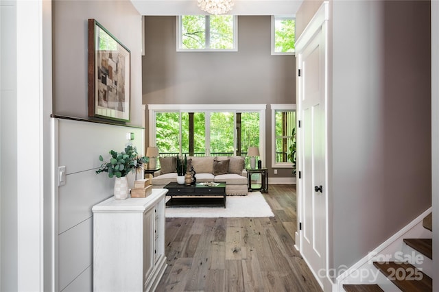 7703 Juniper Ln, Denver, NC 28037 - living area featuring light wood-type flooring and a chandelier