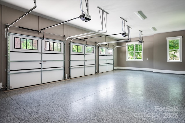 7703 Juniper Ln, Denver, NC 28037 - garage featuring a garage door opener and baseboards