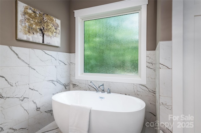 7703 Juniper Ln, Denver, NC 28037 - full bathroom featuring tile walls, a freestanding tub, marble finish flooring, and wainscoting