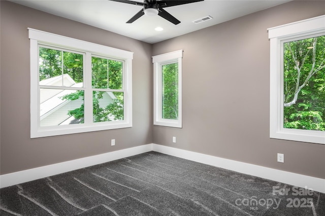 7703 Juniper Ln, Denver, NC 28037 - empty room with healthy amount of natural light, a ceiling fan, baseboards, dark carpet, and recessed lighting