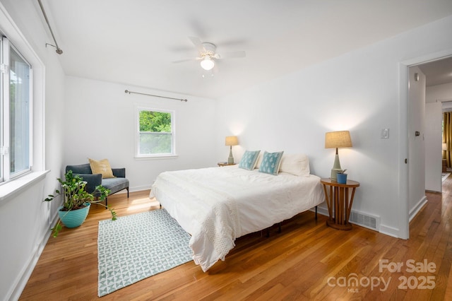 12 Canterbury Rd, Asheville, NC 28805 - bedroom with wood finished floors, baseboards, and a ceiling fan